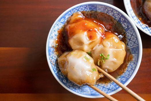 Bawan (Ba wan), Taiwanese meatball delicacy, delicious street food, steamed starch wrapped round shaped dumpling with pork inside, close up, copy space