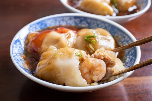 Bawan (Ba wan), Taiwanese meatball delicacy, delicious street food, steamed starch wrapped round shaped dumpling with pork inside, close up, copy space