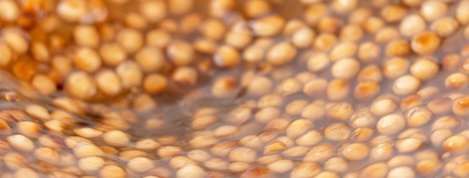 Cooking, boiling brown sugar flavor tapioca pearl balls, ingredient of bubble tea, preparing food and drink, close up, recipe cookbook steps design concept.