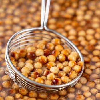 Cooking, boiling brown sugar flavor tapioca pearl balls, ingredient of bubble tea, preparing food and drink, close up, recipe cookbook steps design concept.