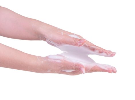 Washing hands isolated on white background. Asian young woman using liquid soap to wash hands, concept of protecting pandemic coronavirus, close up.