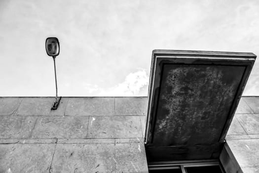 Concrete facade and lamppost monochrome picture
