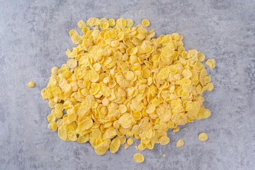 Corn flakes bowl sweets on gray cement background, top view flat lay layout design, fresh and healthy breakbast concept.
