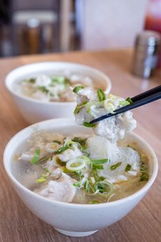 Delicious fish ball rice noodles in thick soup, common food in Tainan, Taiwan, Asia, Asian Taiwanese street delicacy cuisine, close up, lifestyle.