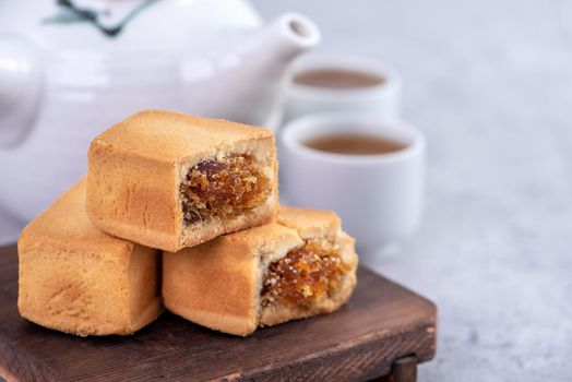 Pineapple cake pastry - Taiwanese famous sweet delicious dessert food with tea, close up, copy space design.