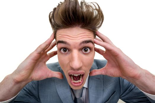 Distorted portrait of frustrated overworked businessman with head in his hands, isolated on white background.    