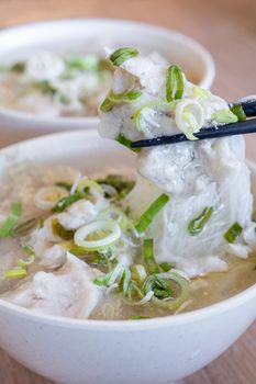 Delicious fish ball rice noodles in thick soup, common food in Tainan, Taiwan, Asia, Asian Taiwanese street delicacy cuisine, close up, lifestyle.
