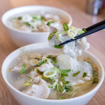 Delicious fish ball rice noodles in thick soup, common food in Tainan, Taiwan, Asia, Asian Taiwanese street delicacy cuisine, close up, lifestyle.