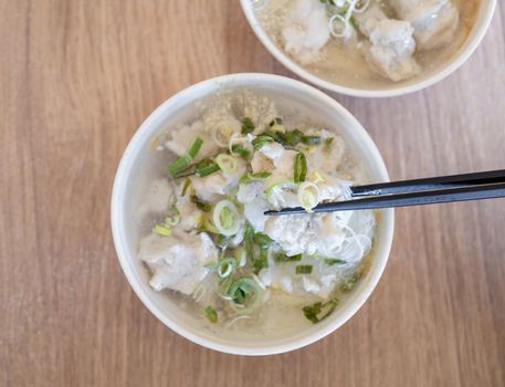 Delicious fish ball rice noodles in thick soup, common food in Tainan, Taiwan, Asia, Asian Taiwanese street delicacy cuisine, close up, lifestyle.