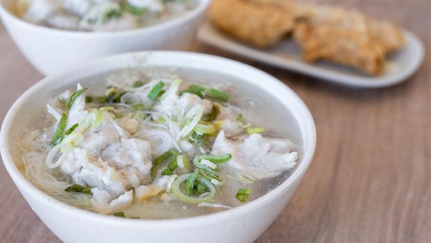 Delicious fish ball rice noodles in thick soup, common food in Tainan, Taiwan, Asia, Asian Taiwanese street delicacy cuisine, close up, lifestyle.