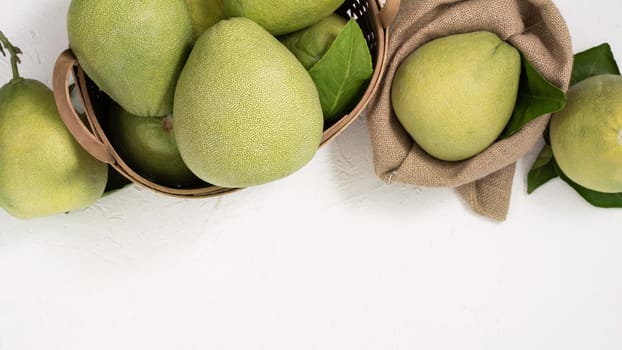 Fresh pomelo, pummelo, grapefruit, shaddock on white background, fruit for Mid-autumn festival, top view, flat lay.