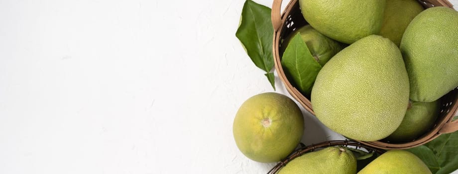 Fresh pomelo, pummelo, grapefruit, shaddock on white background, fruit for Mid-autumn festival, top view, flat lay.