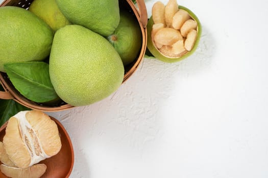 Fresh pomelo, pummelo, grapefruit, shaddock on white background, fruit for Mid-autumn festival, top view, flat lay.