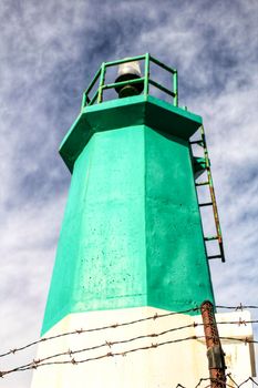Colorful lighthouse in the dock in Santa Pola, Alicante, Spain