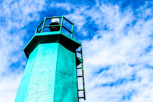 Colorful lighthouse in the dock in Santa Pola, Alicante, Spain