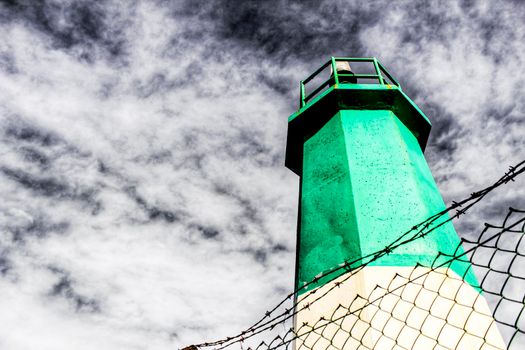 Colorful lighthouse in the dock in Santa Pola, Alicante, Spain