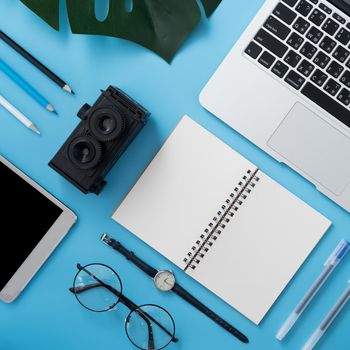 Concept of stylized home office table with fashion accessories, minimal interior, workspace design, close up, flat lay, copy space, top view, mockup