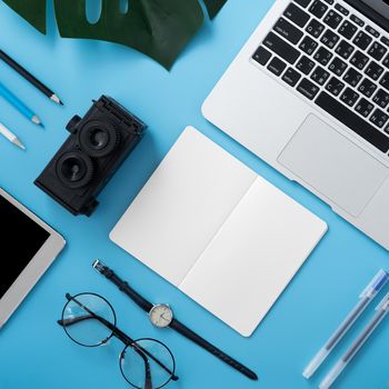 Concept of stylized home office table with fashion accessories, minimal interior, workspace design, close up, flat lay, copy space, top view, mockup