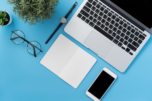 Concept of stylized home office table with fashion accessories, minimal interior, workspace design, close up, flat lay, copy space, top view, mockup