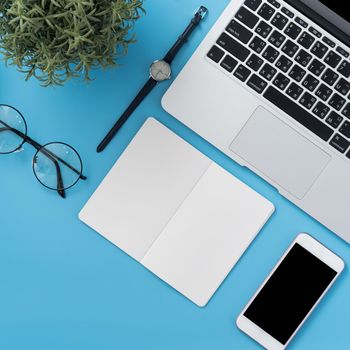 Concept of stylized home office table with fashion accessories, minimal interior, workspace design, close up, flat lay, copy space, top view, mockup