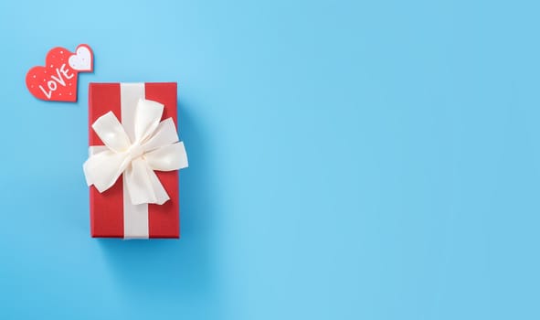 Concept of beautiful Valentine's day, anniversary, mother's day and birthday present and greetings on blue background, copyspace, topview, mockup