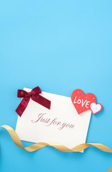 Concept of beautiful Valentine's day, anniversary, mother's day and birthday present and greetings on blue background, copyspace, topview, mockup