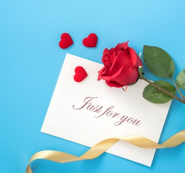 Concept of beautiful Valentine's day, anniversary, mother's day and birthday present and greetings on blue background, copyspace, topview, mockup
