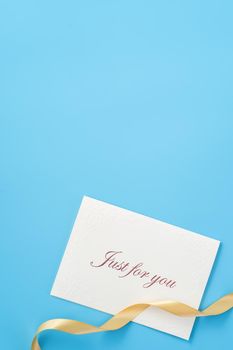 Concept of beautiful Valentine's day, anniversary, mother's day and birthday present and greetings on blue background, copyspace, topview, mockup