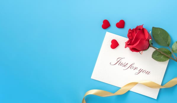 Concept of beautiful Valentine's day, anniversary, mother's day and birthday present and greetings on blue background, copyspace, topview, mockup