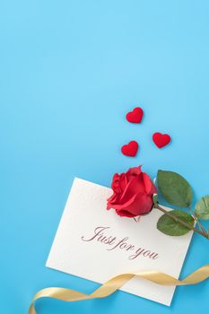 Concept of beautiful Valentine's day, anniversary, mother's day and birthday present and greetings on blue background, copyspace, topview, mockup