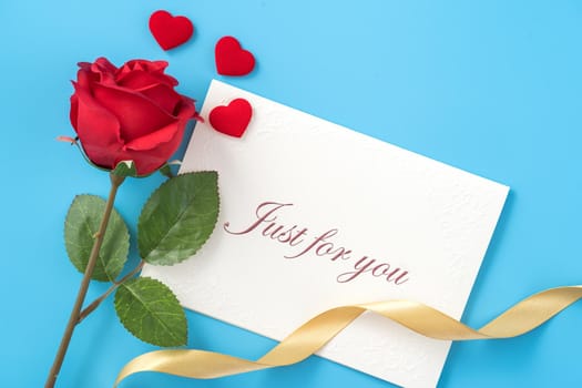 Concept of beautiful Valentine's day, anniversary, mother's day and birthday present and greetings on blue background, copyspace, topview, mockup