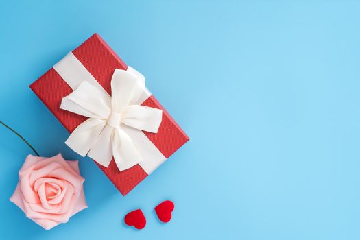 Concept of beautiful Valentine's day, anniversary, mother's day and birthday present and greetings on blue background, copyspace, topview, mockup