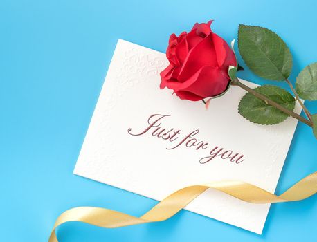 Concept of beautiful Valentine's day, anniversary, mother's day and birthday present and greetings on blue background, copyspace, topview, mockup