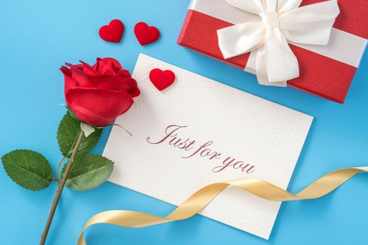 Concept of beautiful Valentine's day, anniversary, mother's day and birthday present and greetings on blue background, copyspace, topview, mockup