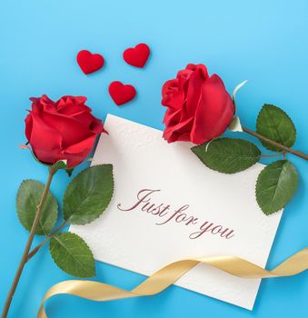 Concept of beautiful Valentine's day, anniversary, mother's day and birthday present and greetings on blue background, copyspace, topview, mockup