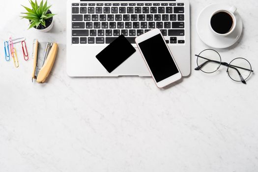 Online payment concept, mock up credit card with office desk computer isolated on beautiful marble background, workspace design, topview, flatlay, copyspace.