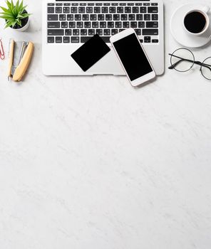 Online payment concept, mock up credit card with office desk computer isolated on beautiful marble background, workspace design, topview, flatlay, copyspace.