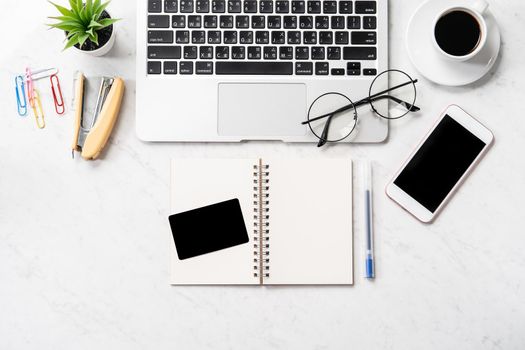 Online purchase concept, mock up credit card with fashion office desk computer isolated on beautiful marble background, workspace design, topview, flatlay, copyspace, closeup