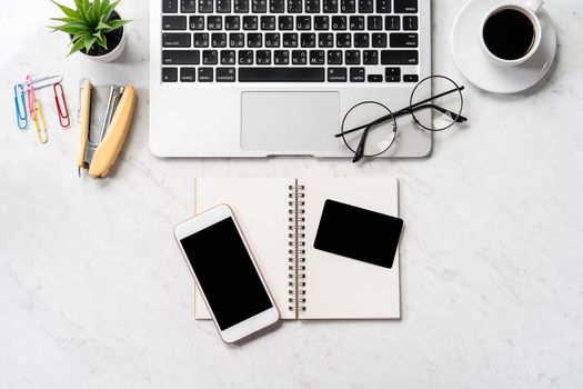 Online purchase concept, mock up credit card with fashion office desk computer isolated on beautiful marble background, workspace design, topview, flatlay, copyspace, closeup