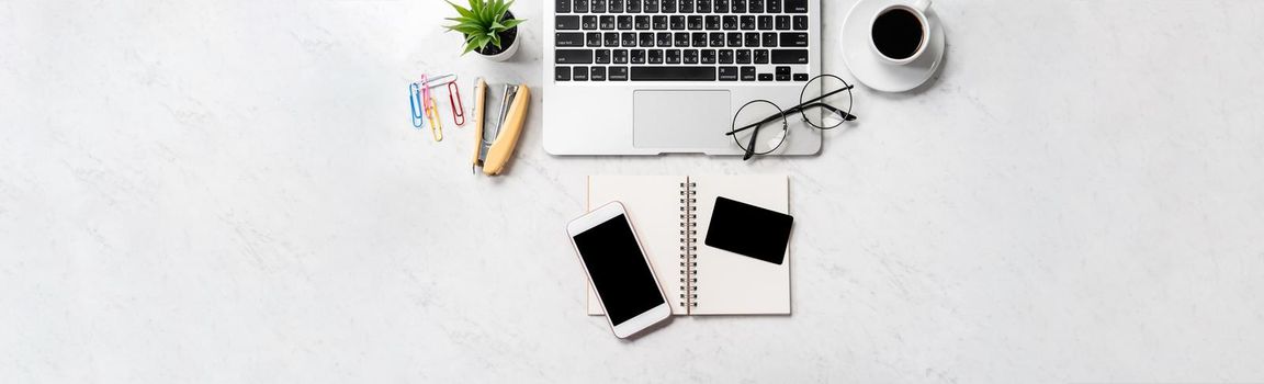 Online purchase concept, mock up credit card with fashion office desk computer isolated on beautiful marble background, workspace design, topview, flatlay, copyspace, closeup