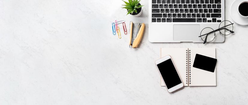 Online purchase concept, mock up credit card with fashion office desk computer isolated on beautiful marble background, workspace design, topview, flatlay, copyspace, closeup