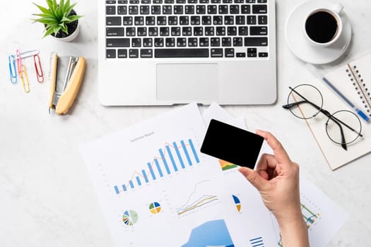 Online bill payment concept, a woman using mock up credit card and mobile cell phone on office desk isolated on beautiful fashion marble background, copy space, topview, flatlay, closeup