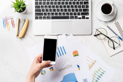 Online bill payment concept, a woman using mock up credit card and mobile cell phone on office desk isolated on beautiful fashion marble background, copy space, topview, flatlay, closeup