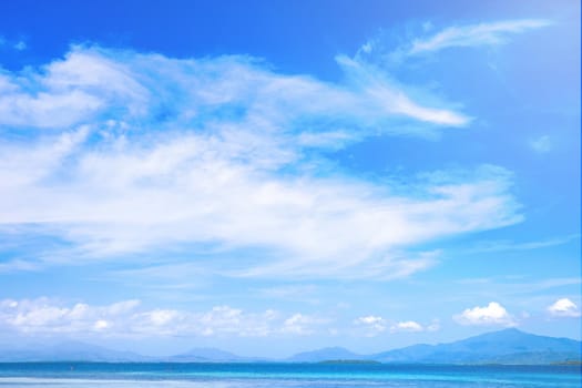 Beautiful ocean scene view isolated with light blue sky background, concept of vacation and sea travel, copy space