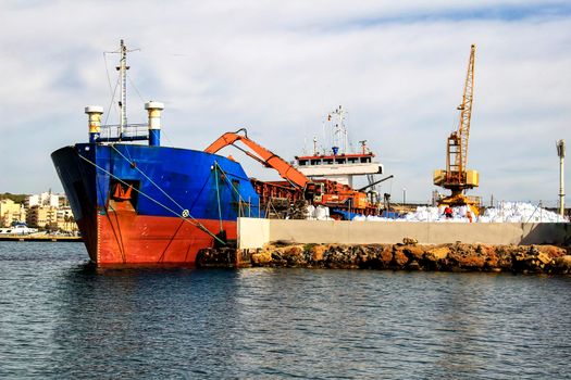 Merchant ship unloading at the dock in Santa Pola, Alicante, Spain