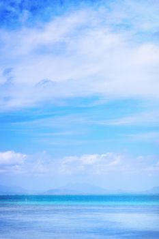 Beautiful ocean scene view isolated with light blue sky background, concept of vacation and sea travel, copy space