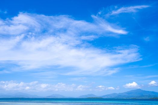 Beautiful ocean scene view isolated with light blue sky background, concept of vacation and sea travel, copy space