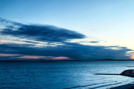 Spectacular and colorful sunset in the bay of Santa Pola, Alicante, Spain in autumn