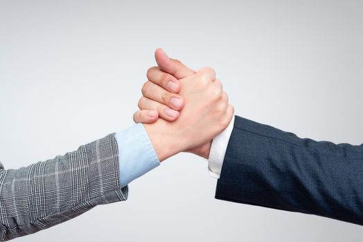 Two Professional Well-Dressed Corporate Businessmen Handshake Indoors