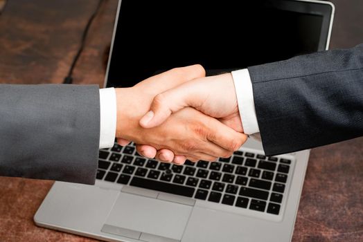 Two Professional Well-Dressed Corporate Businessmen Handshake Indoors